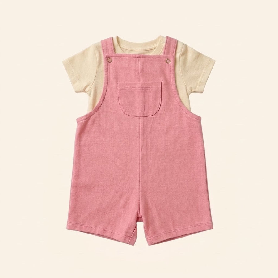 Rose-pink cotton dungaree over a white tee, laid flat